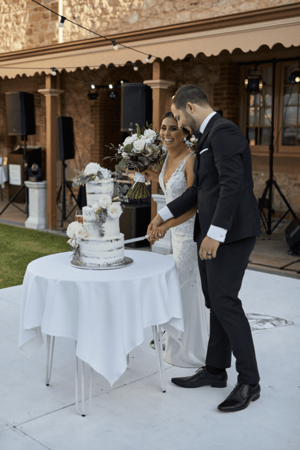 cutting wedding cake