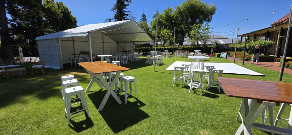 Wedding reception at Partridge House in Glenelg, South Australia, featuring a marquee, lighting, dance floor and furniture supplied by Australian Hiring Company, with installation by AHC+ event specialists.