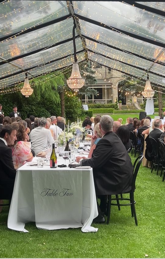 Black marquee wedding reception at Eurilla Estate with chandeliers, formal dining setup, and timber dance floor.
